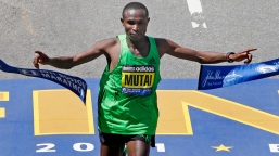 Geoffrey Mutai finishing the 2011 Boston Marathon. His time of 2 hours 3 minutes and 2 seconds set a new record of the fastest marathon ever. (Photo: http://www.npr.org)